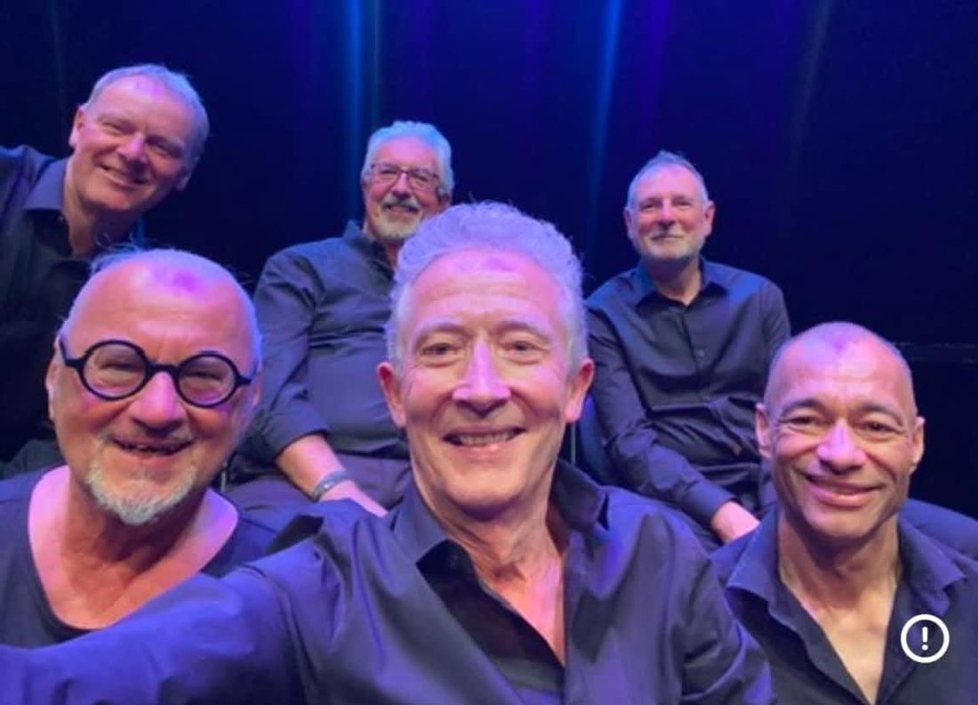 The men from the Everyvoice choir snap a selfie during our main stage show